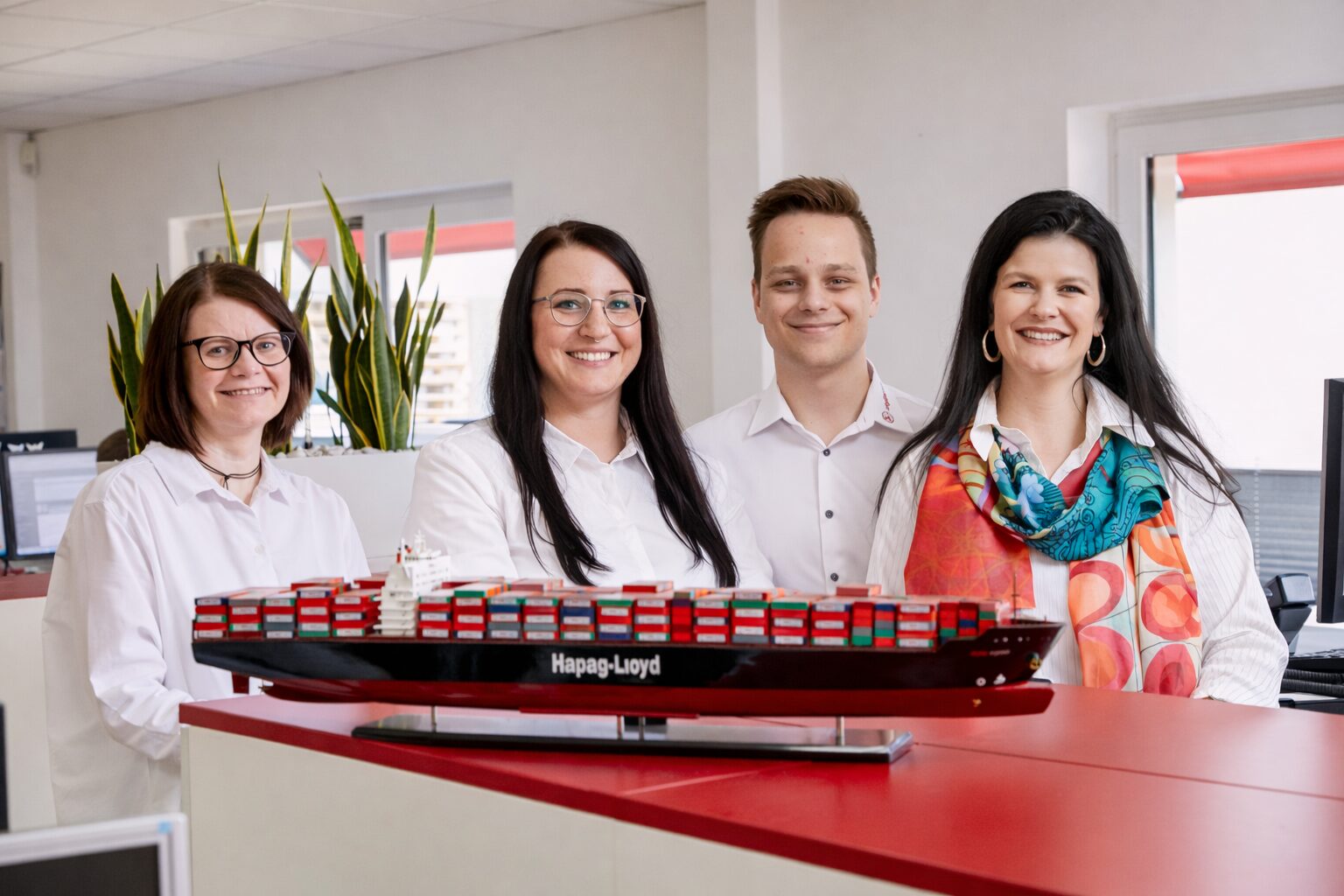 Teambild mit 4 Personen